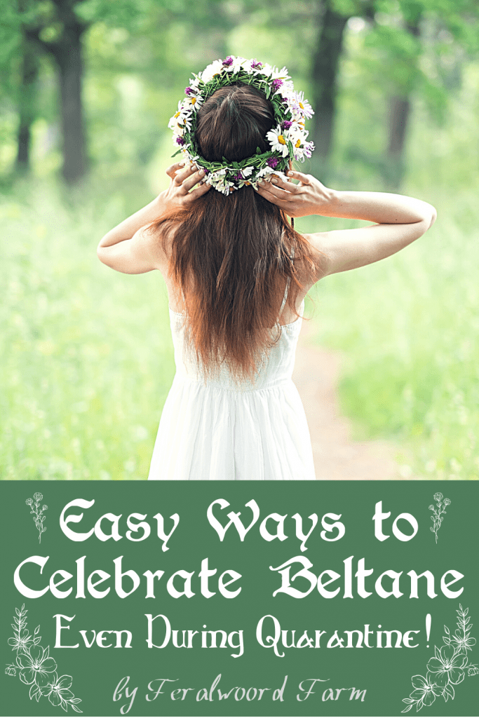 A "Pin It" graphic titled "Easy Ways to Celebrate Beltane Even During Quarantine!" featuring a woman in a white dress with long, flowing hair, adorned with a floral crown, standing on a forest path surrounded by greenery. The soft, natural setting evokes the beauty and renewal of Beltane.